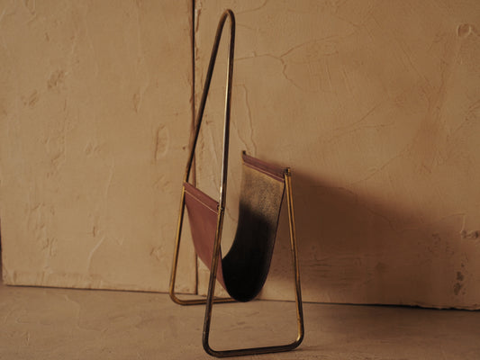 CARL AUBÖCK. Magazine holder in brass and leather, Austria
