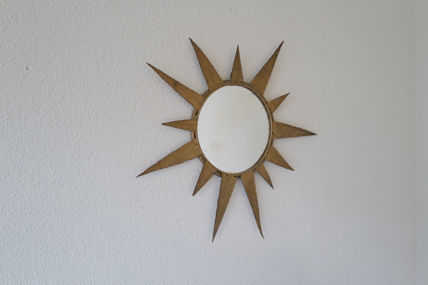 Small vintage sun mirror in gold metal. Handcrafted 50s 60s