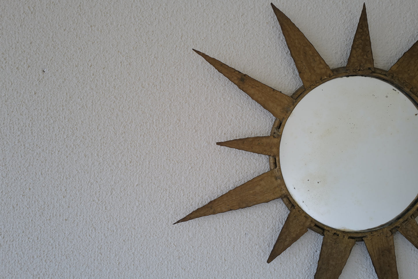 Small vintage sun mirror in gold metal. Handcrafted 50s 60s