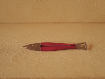 Carl Auböck One shaped like a fish in steel, covered in red leather. Model 4687