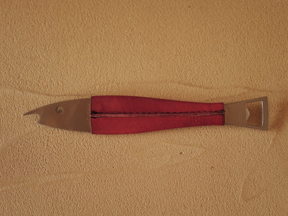 Carl Auböck One shaped like a fish in steel, covered in red leather. Model 4687