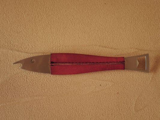 Carl Auböck One shaped like a fish in steel, covered in red leather. Model 4687