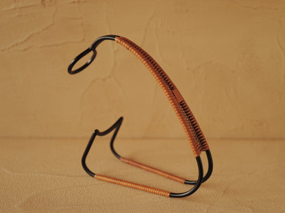 1960s Bottle holder in black lacquered metal wrapped with rattan