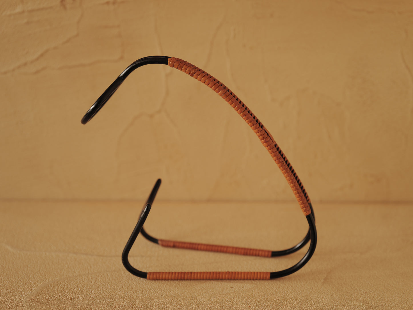 1960s Bottle holder in black lacquered metal wrapped with rattan