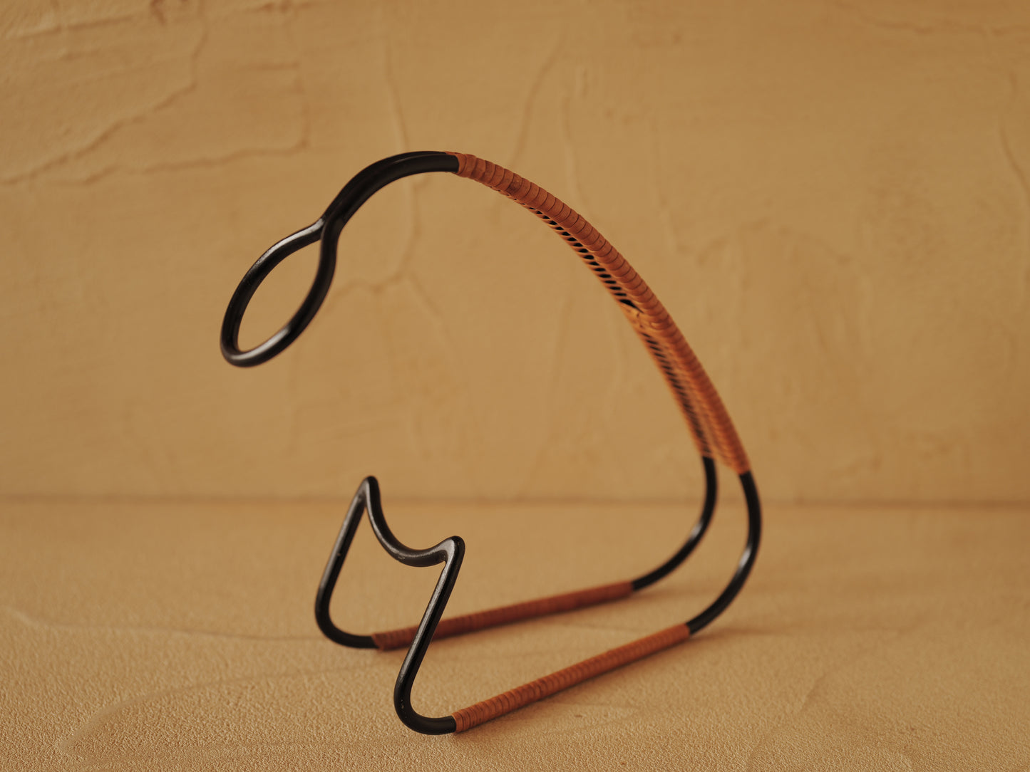 1960s Bottle holder in black lacquered metal wrapped with rattan