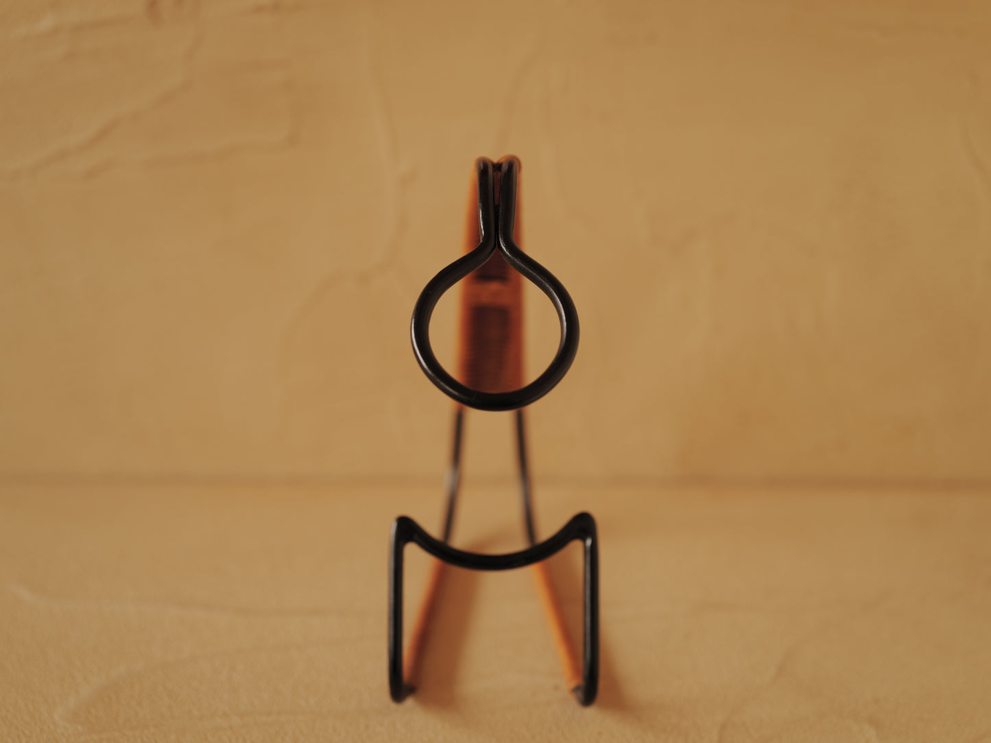 1960s Bottle holder in black lacquered metal wrapped with rattan