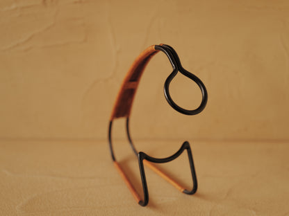 1960s Bottle holder in black lacquered metal wrapped with rattan