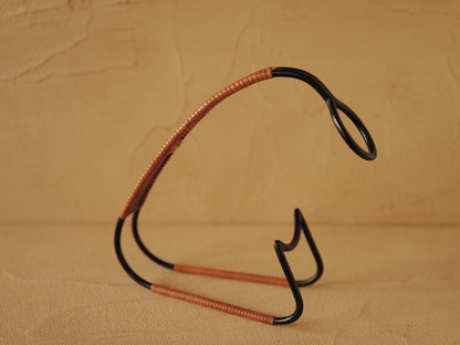 1960s Bottle holder in black lacquered metal wrapped with rattan