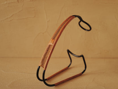 1960s Bottle holder in black lacquered metal wrapped with rattan