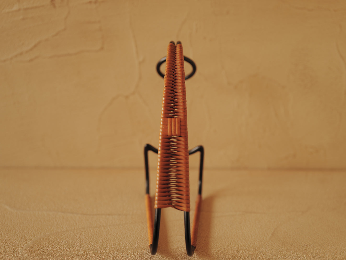 1960s Bottle holder in black lacquered metal wrapped with rattan