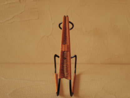 1960s Bottle holder in black lacquered metal wrapped with rattan
