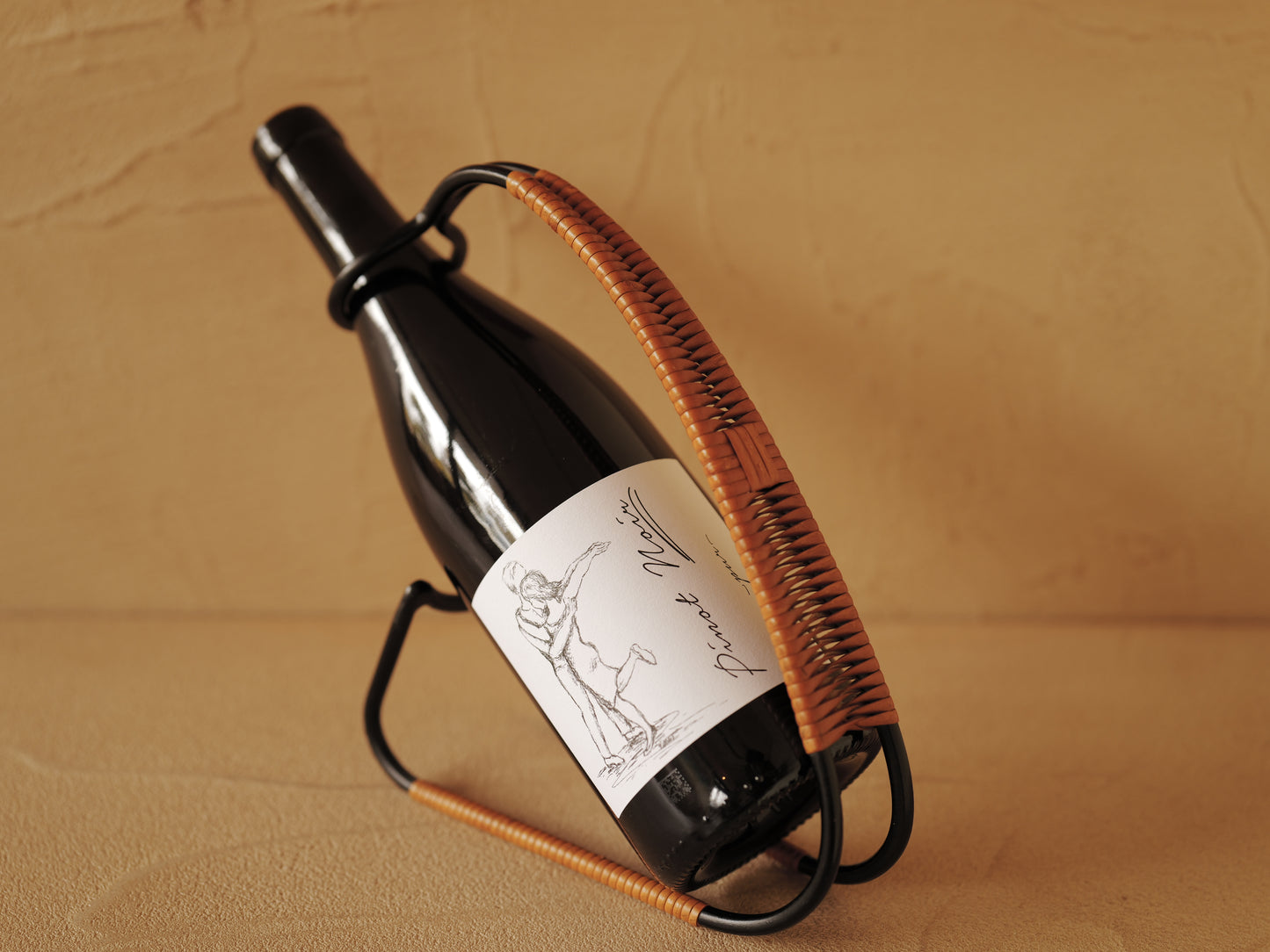 1960s Bottle holder in black lacquered metal wrapped with rattan