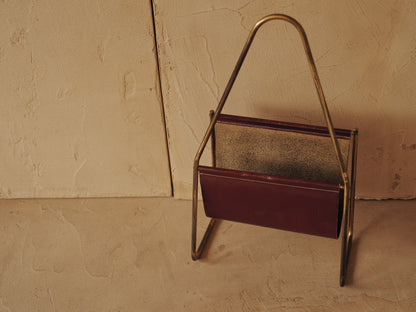 CARL AUBÖCK. Magazine holder in brass and leather, Austria
