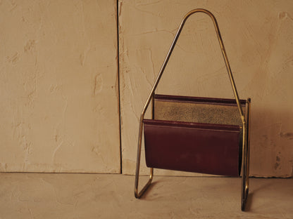 CARL AUBÖCK. Magazine holder in brass and leather, Austria