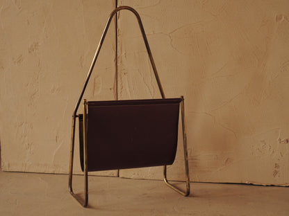 CARL AUBÖCK. Magazine holder in brass and leather, Austria