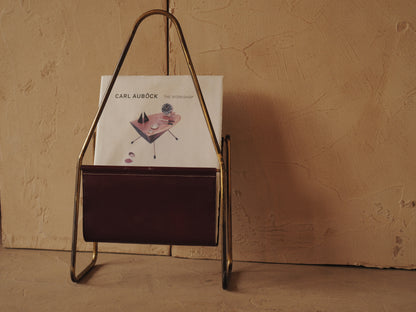CARL AUBÖCK. Magazine holder in brass and leather, Austria