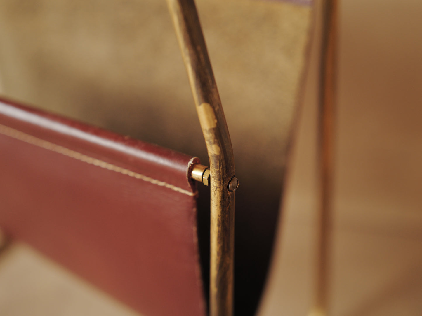 CARL AUBÖCK. Magazine holder in brass and leather, Austria