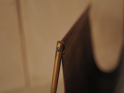 CARL AUBÖCK. Magazine holder in brass and leather, Austria