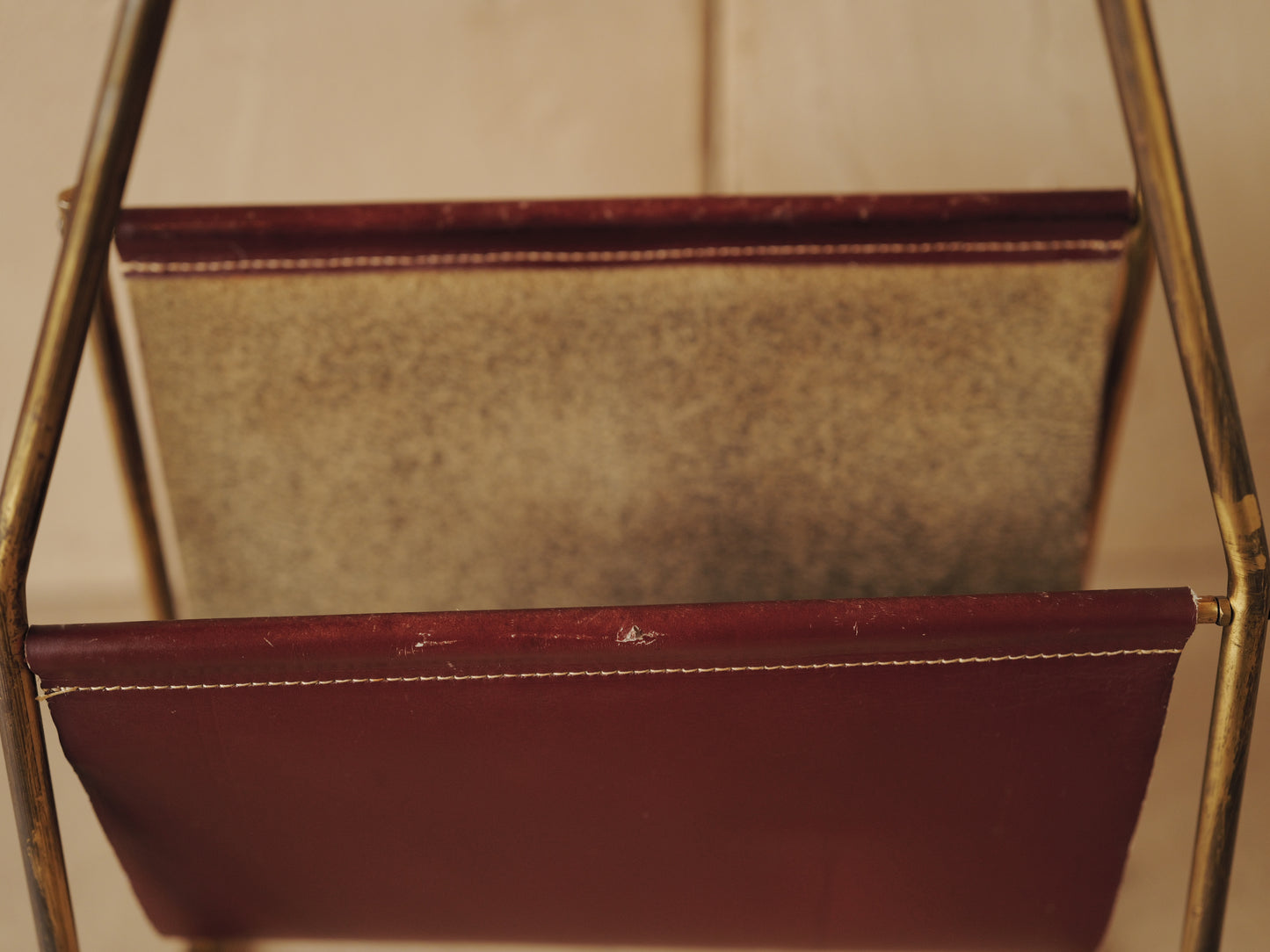 CARL AUBÖCK. Magazine holder in brass and leather, Austria